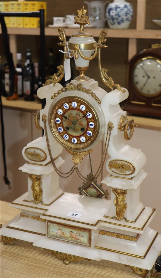 A late 19th century French alabaster mantel clock with painted decoration height 57cm